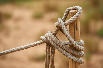 View of the pole and rope over blur background