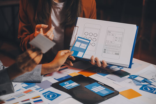 team of UI UX web designer are working together to develop mobile responsive websites. Mobile Mockup