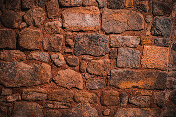 textured ancient wall made out of different kinds of stones, wall made out of stones and mortar, castle wall