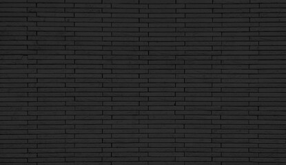 empty background of wide dark black brick wall texture. grunge brick wall stone textured, wallpaper of limestone. grid pattern of uneven interior rock stones. architectural wall design backdrop.
