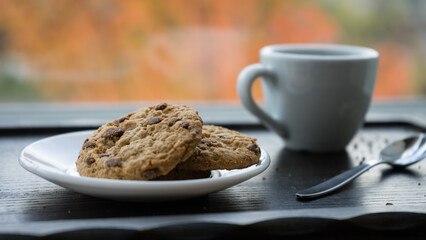 A cup of coffee and cookies. Caffeine Harmony: A Perfect Blend with Sweet Bites.
