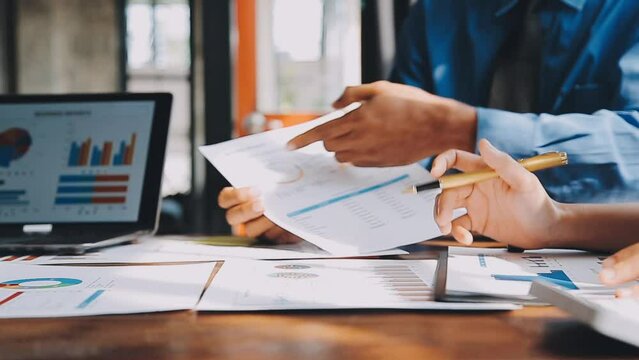 Business team meeting present, investor colleagues consultation and conference new strategy plan business and market growth on financial document graph report, Meeting and Talking.