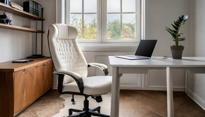 a cozy workplace in a home office with a white leather office chair