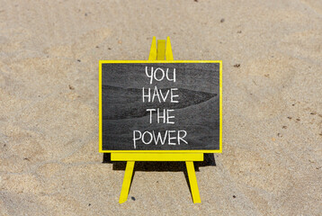 You have the power symbol. Concept word You have the power on beautiful black chalk blackboard. Beautiful sand beach background. Business motivational you have the power concept. Copy space.
