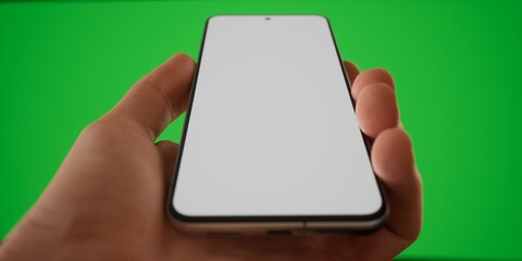 CU Caucasian man holding phone on a green background, blank screen mockup