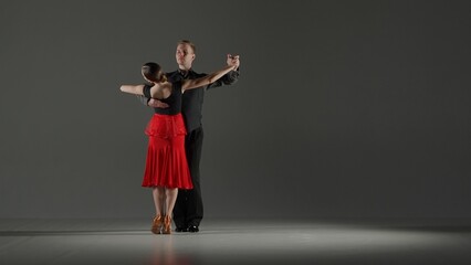 Elegant Ballroom Dance Couple on Spotlight.