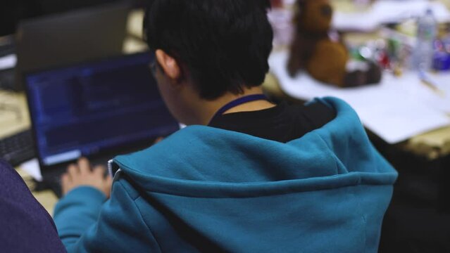 Software developer students in auditorium hall working on computer and laptop, programming contest hackathon competition, pc with coding program app, competitive programming for software engineer