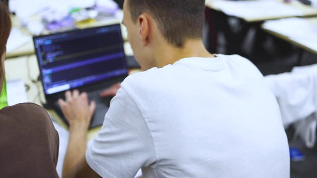Software developer students in auditorium hall working on computer and laptop, programming contest hackathon competition, pc with coding program app, competitive programming for software engineer