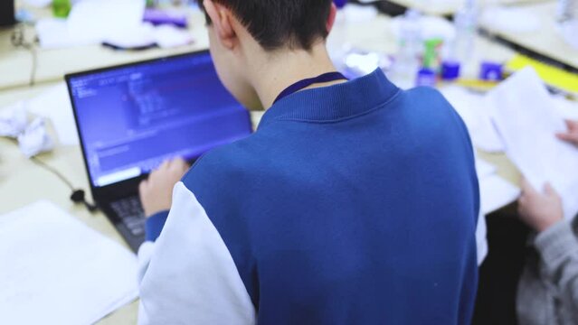 Software developer students in auditorium hall working on computer and laptop, programming contest hackathon competition, pc with coding program app, competitive programming for software engineer