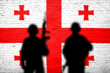 Georgians flag on the brick wall with soldiers