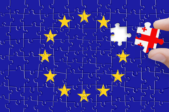 Puzzle made from Europe Union and Georgia flags. Georgia and European Union relationships