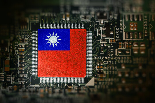 Flag of Taiwan on a processor. Computer board with chip. Artificial intelligence or AI