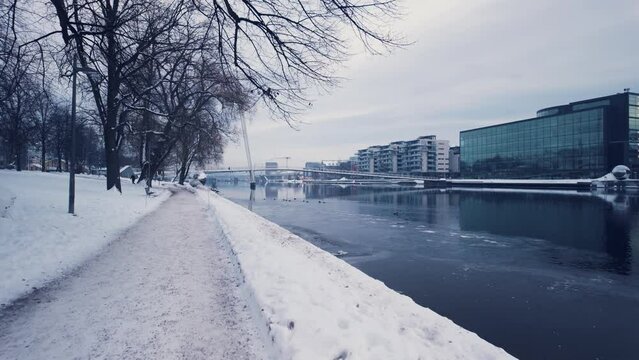 Drammen city, Norway. The river is called Drammenselva, and the bridge is called Ypsilon.  The city's library is located on the right side of the river.