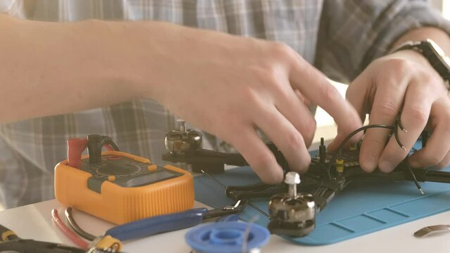 Man Assembling FPV Copter At Home, Drone Hobby Construction