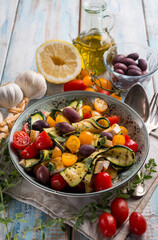 chicken salad with zucchinis cherry tomatoes black olives and lemon