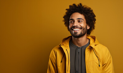 Obraz premium smiling african american man in yellow jacket on yellow background. ai generated