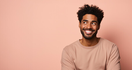 Obraz premium Happy african american man smiling at camera isolated on pink background. ai generated