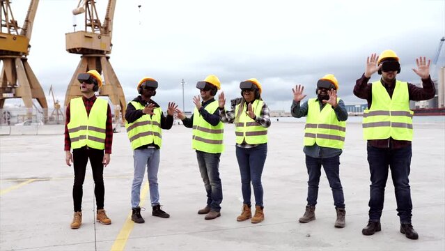 large group of coworkers shipping in container with virtual reality glasses - gamification concept