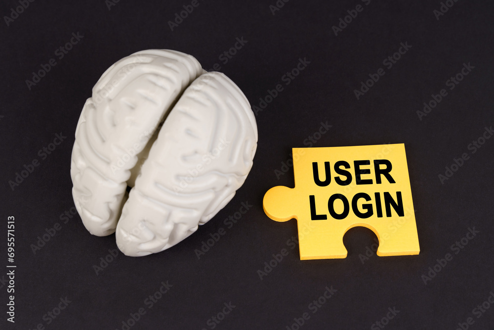 Poster On a black surface lies a brain and a yellow puzzle with the inscription - User login