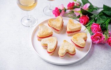 Sausage tomato cheese canapes in the form of heart for Valentine's day holiday