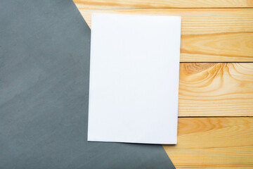 White mockup blank on wooden background, flat lay, top view