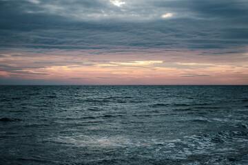 Fototapeta premium Winter Mediterranean sea waves landscape photo. Peaceful sunset time. Calm waves during vacation.