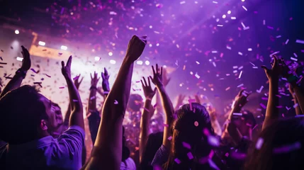 Foto auf Leinwand Close up photo of many party people dancing purple lights confetti flying everywhere nightclub event hands raised up wear shiny clothes © Johannes
