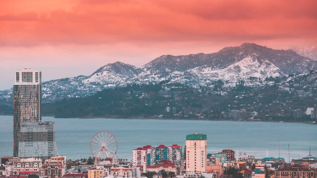 Batumi, Adjara, Georgia. Elevated view Ferris Wheel At Promenade In Miracle Park, Amusement City Park sunset timelapse.