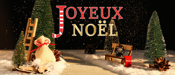 Beautiful greeting card with text JOYEUX NOEL (French for Merry Christmas)