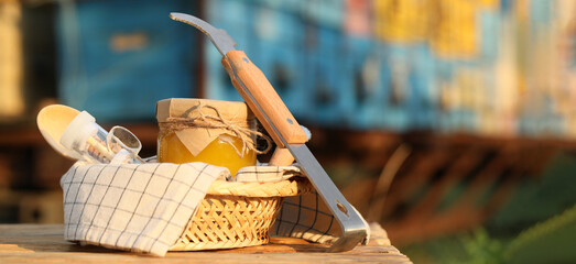 Beekeeping supplies and honey at apiary. Banner for design