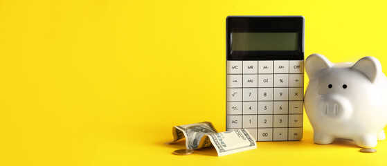 Piggy bank, calculator and money on yellow background with space for text - obrazy, fototapety, plakaty