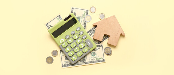 Calculator, figure of house and money on yellow background