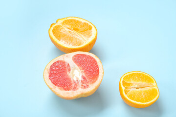 fresh citruses on blue background, closeup. Sex education concept