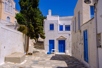 Fototapeta na wymiar Street in traditional greek village Pyrgos with whitewashed white and blue houses