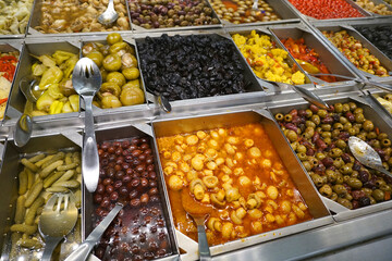 variety of colorful fresh olive and vegetable salad in restaurant