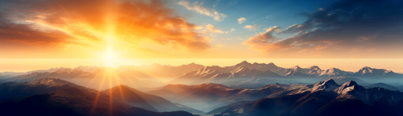 Sunrise Over Misty Mountain Range. Early morning sun bathes the layered hills and valleys in warm golden light.