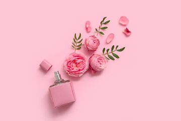 Beautiful composition with bottle of perfume and rose flowers on pink background - obrazy, fototapety, plakaty