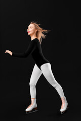 Beautiful female figure skater in ice skates on black background © Pixel-Shot