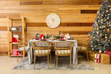 Interior of living room with festive dining table and Christmas tree