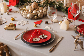 Festive table setting with beautiful Christmas decorations, closeup