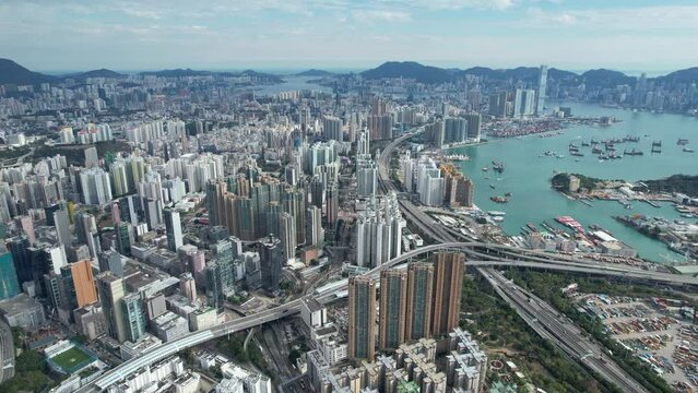 Hong Kong Kowloon Aerial shot of the residential area at mid level and the central financial business along the sides of the Victoria Harbour
