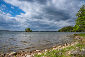 Summer landscape: a lake in cloudy weather