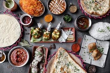 Variety of Indian food dishes on restaurant table