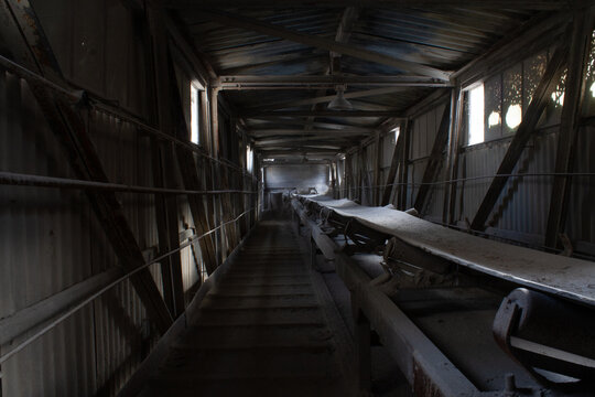 Dark corridor in abandoned factory in winter. Urban exploration. Urbex