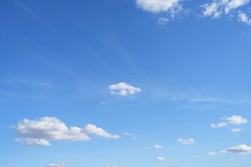 Naklejka na ściany i meble Blue sky background with fluffy clouds in summer