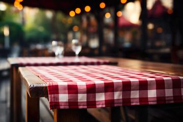 Outdoor restaurant table with checkered tablecloth - obrazy, fototapety, plakaty