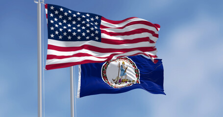 Virginia state flag waving with the american flag on a clear day