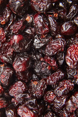 Dried and sweetened cranberries texture food background. A macro view of dried cranberries