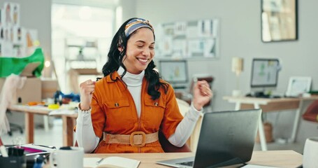 Laptop, winner and applause with a fashion designer woman at her desk in celebration of a target. Computer, success and a happy young creative employee clapping in the office for a deal or goal