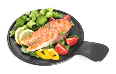 Healthy meal. Grilled salmon steak, green onion, lemon and vegetables isolated on white